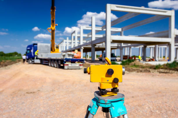 istock Geodesist device on tripod on a building site 1143014415