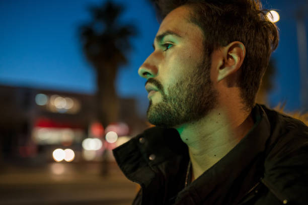 istock Cool young man crossing the street 1143015426