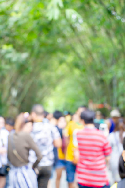 istock blurred people walking in the  park 1143015431