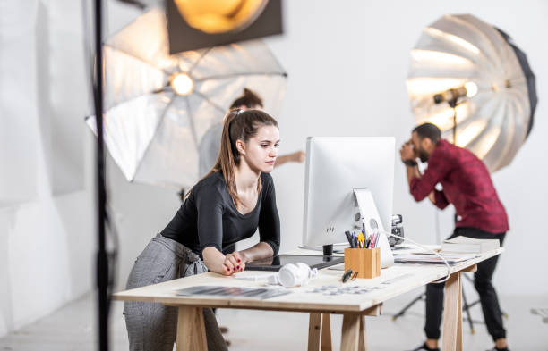istock Small Group of Photographers Working in The Studio 1143015572