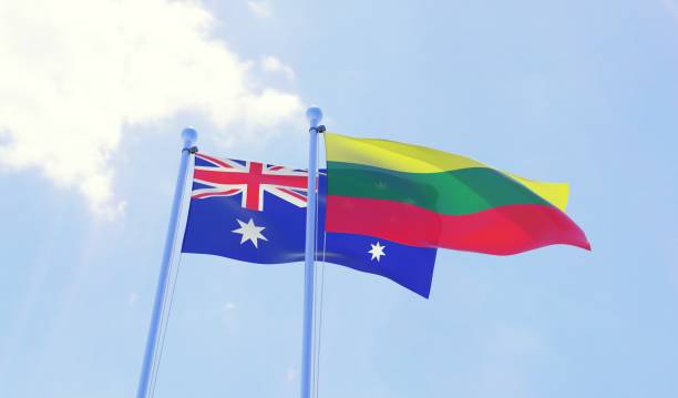 istock Australia and Lithuania, two flags waving against blue sky 1143015604