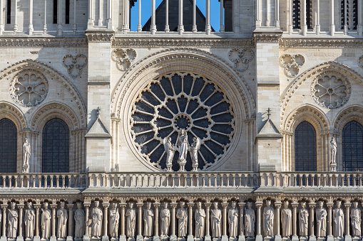Detail of the front facae of the historic two towers of the Notre Dame Cathedral in Paris, France.