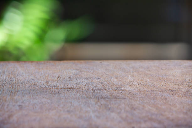 istock Empty wooden table texture, Green garden blurred bokeh background, Selective focus 1143016629