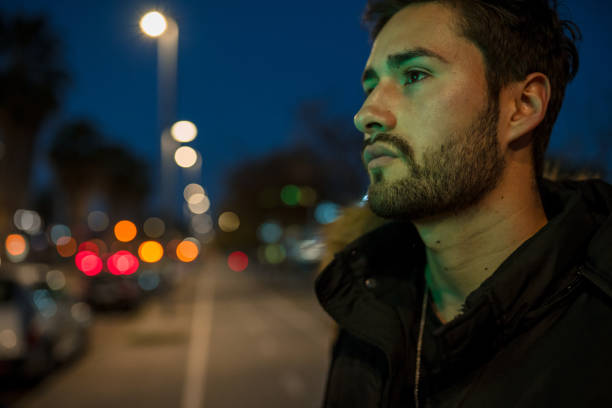 istock Cool young man crossing the street 1143016960