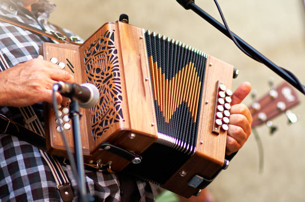 Concertina popular accordion player in the street Concertina popular accordion player in the street accordion instrument stock pictures, royalty-free photos & images