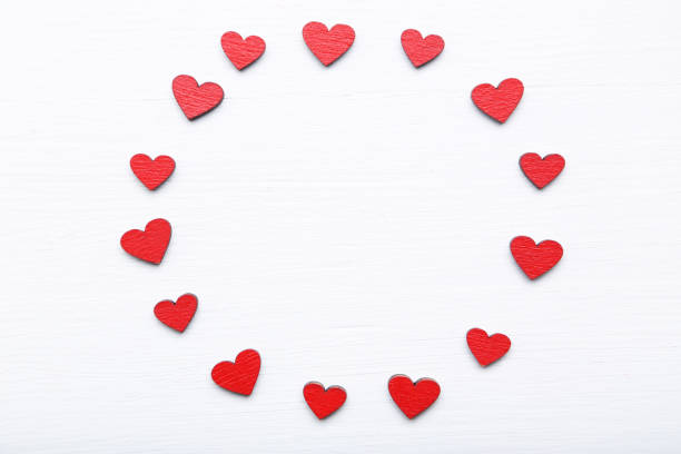 istock Red valentine hearts on white wooden table 1143021079