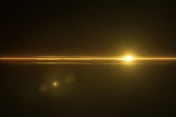 istock Abstract background lighting flare.digital lens flare in black background horizontal frame warm 1143024338