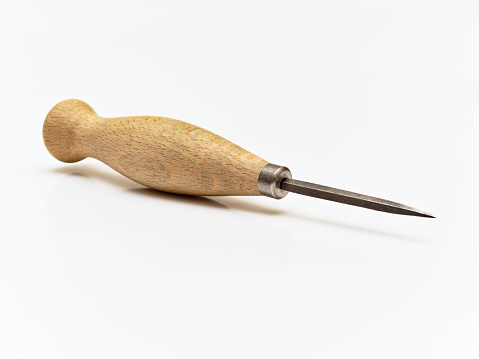 Stitching Awl. Leather working tool isolated on white background.