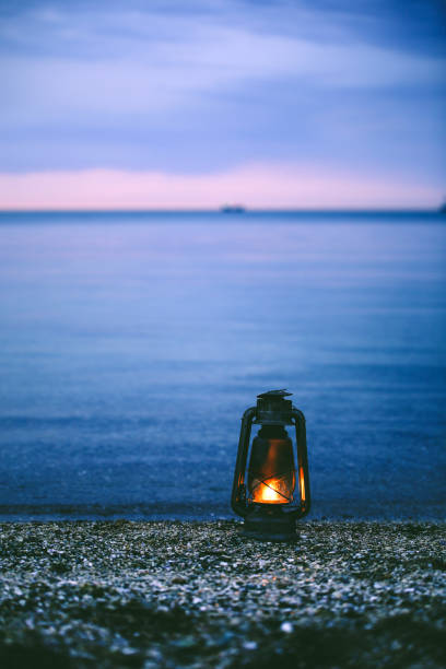 istock Vintage lamp isolated on the sea 1143025830