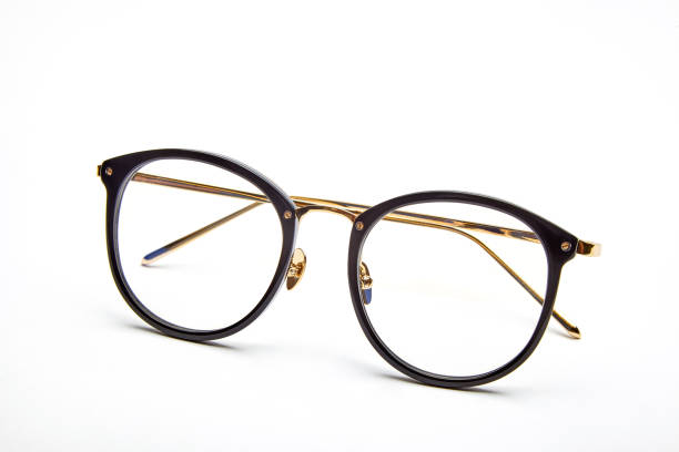 istock Golden framed glasses on white background 1143026094