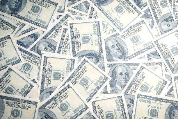 istock Dollar banknotes background. One hundred dollar banknotes. Money background. 1143026823