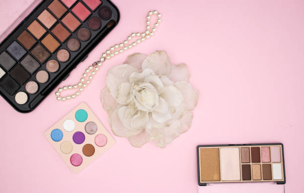 istock Woman's accessories and make up products on pink background 1143027352