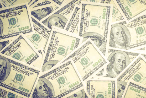 istock Dollar banknotes background. One hundred dollar banknotes. Money background. 1143027393