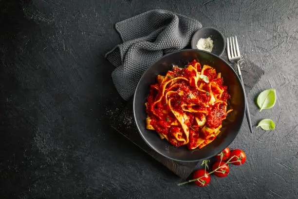 Photo of Tasty italian pizza with tomato sauce and parmesan