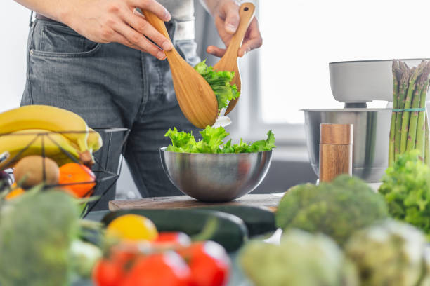 istock Young man chef cooking healthy food 1143028106