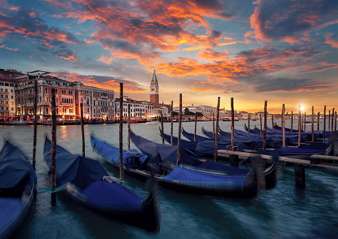 The famous Gondolas are parking on the Canal Grande at sunset in Venice, Italy