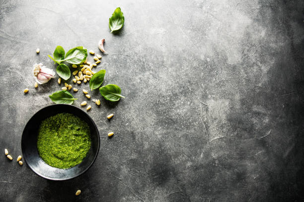 istock Ingredients for pesto on grey concrete background 1143032261