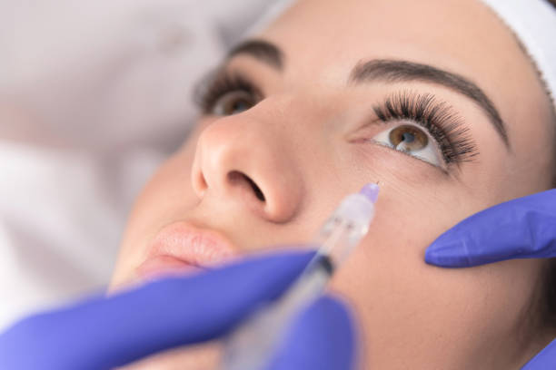 istock Doctor injecting substance with syringe 1143032979