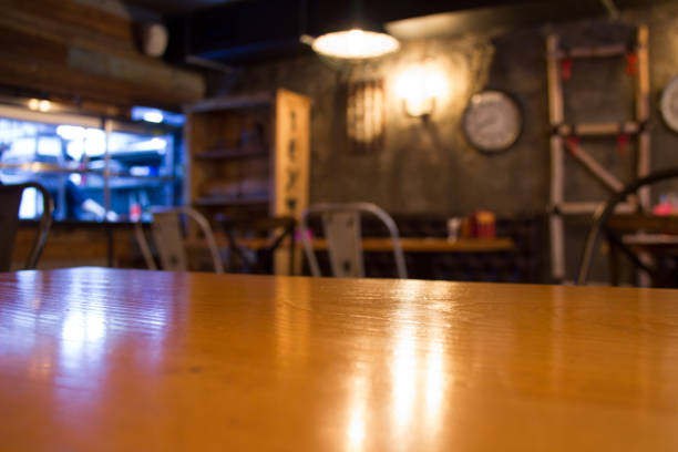 istock Wooden table top in restaurant on blurred interior background. 1143033697