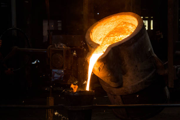 istock metal casting process with red high temperature fire in metal part factory 1143035351