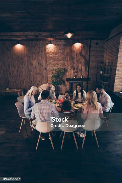 Vertical Photo People Big Large Family Conversation Communication Cute Atmosphere Members Company Brother Sister Granny Mom Dad Grandpa Son Daughter Sit Tasty Dishes Table Loft House Indoors Stock Photo - Download Image Now