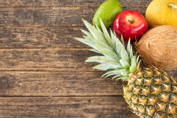 istock Tropical fruits on the wooden rustic table 1143037953