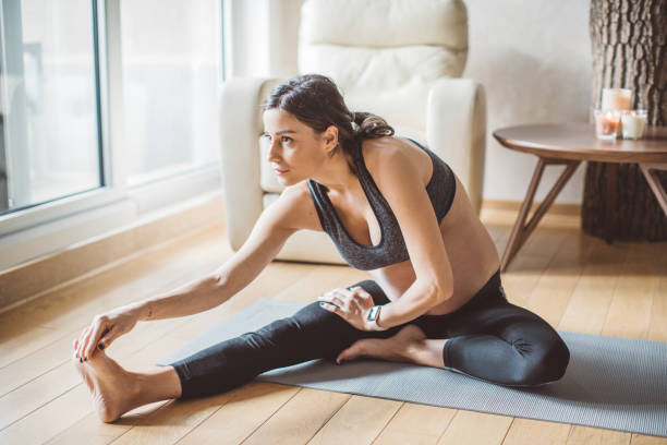 istock Pregnant woman exercise yoga 1143039356