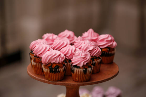 istock Delicious pink cupcakes on stander 1143039513
