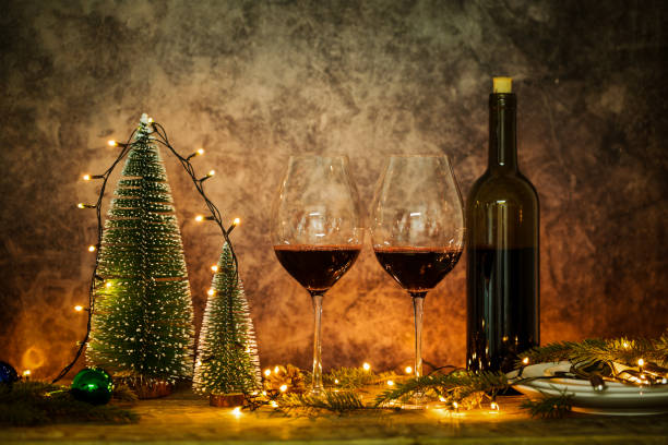 istock Red wine glasses with Christmas lights 1143040835