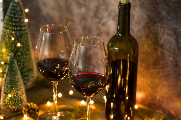 istock Red wine glasses with Christmas lights 1143040891