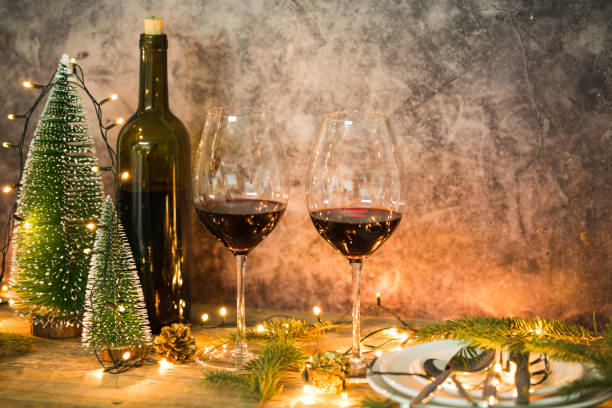 istock Red wine glasses with Christmas lights 1143041084