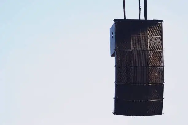 Photo of powerful speakers set hanging over on the stage