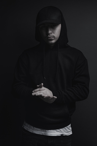 Young Cool Rapper With Black Hoodie And Cap Clap His Hands In Front Of Grey  Background Stock Photo - Download Image Now - iStock