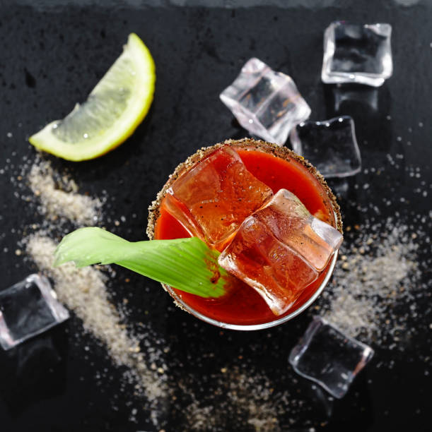 istock Bloody Mary, Cocktail, stone background,celery, top view, vodka, tomato juice with celery, lemon and spices, citrus, cocktail pick, topping, ingredient, salted, rim, prepared, served, 1143045007