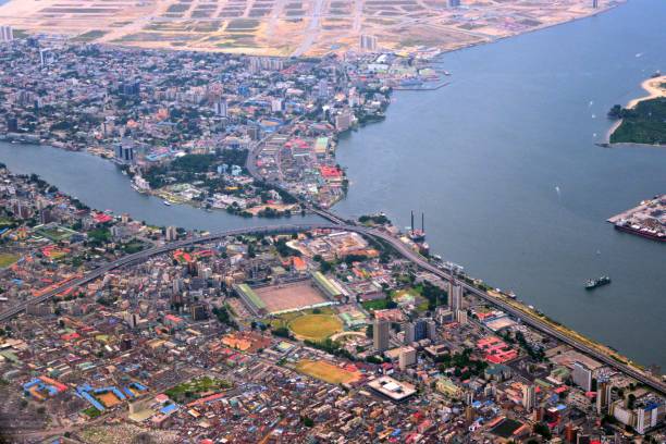 Lagos from the air - Lagos island and Victoria Island - central business district - Lagos Lagoon and Five Cowrie Creek, Nigeria Lagos, Nigeria: the city from the air - Lagos island and Victoria Island separated by Five Cowrie Creek - Eko Atlantic City land reclamation - Lagos Lagoon, Gulf of Guinea, Atlantic Ocean in the backround. lagos nigeria stock pictures, royalty-free photos & images