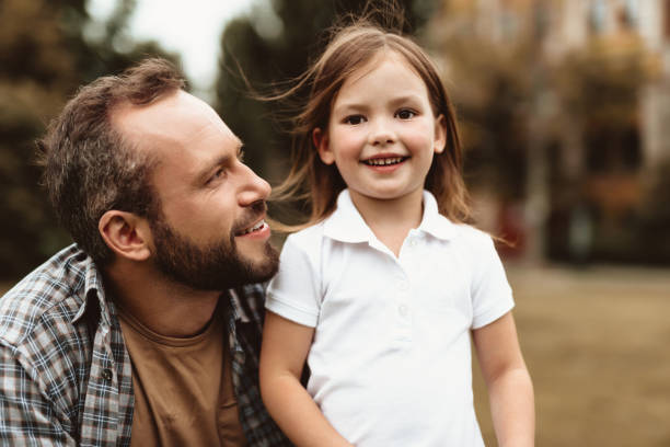 istock Smiling girl admiring time with father 1143045661