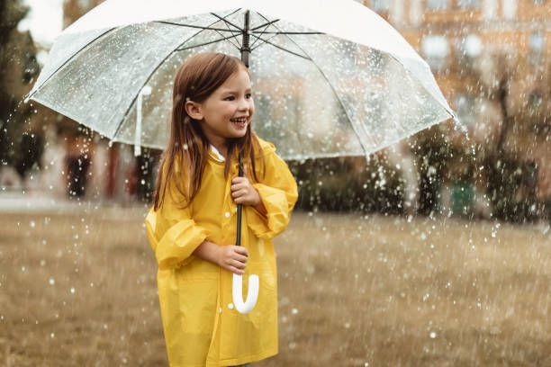 istock Delighted kid enjoying rainy day 1143045678