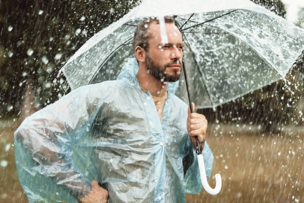 istock Thoughtful man contemplating in rainy weather 1143045721