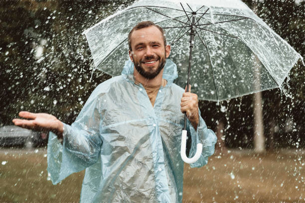 istock Positive man being happy in rain 1143045749