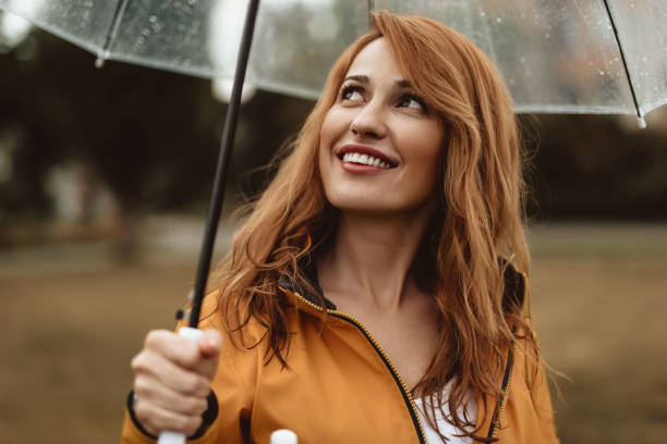 istock Happy woman relaxing outdoors with joy 1143045826