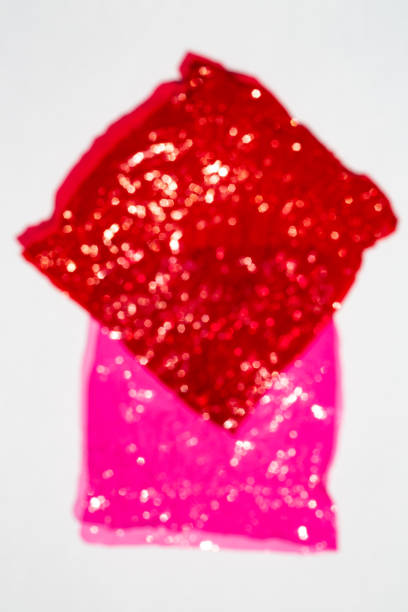 istock Blurred bokeh thin sheet of multi coloured cellophane with shiny crumpled surface texture on white background, Abstract, Light & Shadow concept 1143045839
