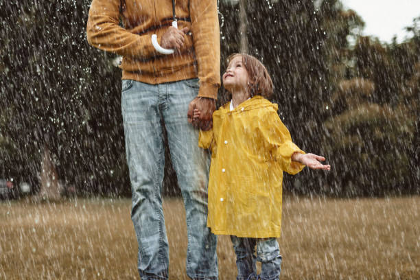 Small kid playing with dad outdoors