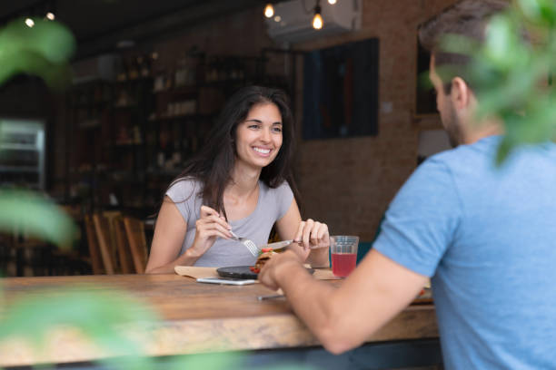 istock Happy woman on a date at a restaurant 1143046054