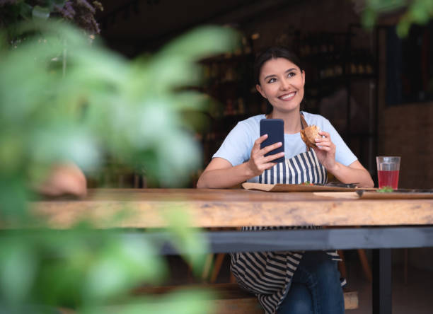 istock Thoughtful waitress eating on her lunch break 1143046076