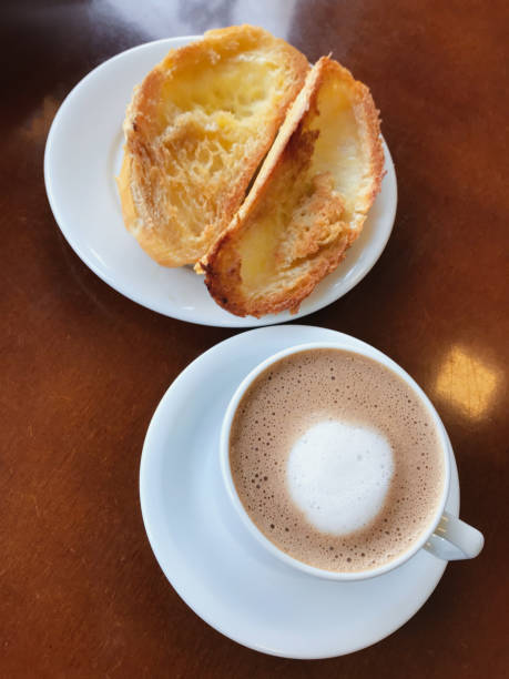 istock Brazilian breakfast. Bread toast with butter and coffee on a table. 1143046408