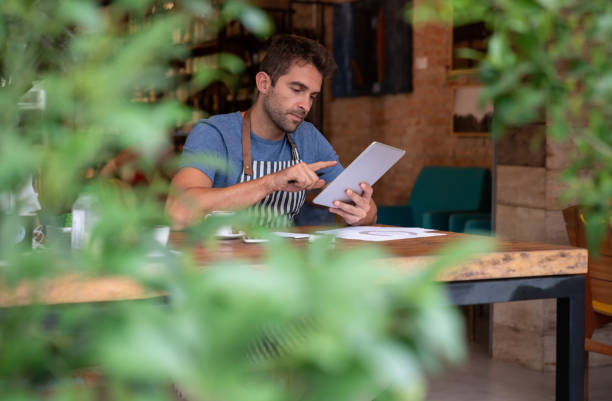 istock Business man doing the books at a cafe 1143048266