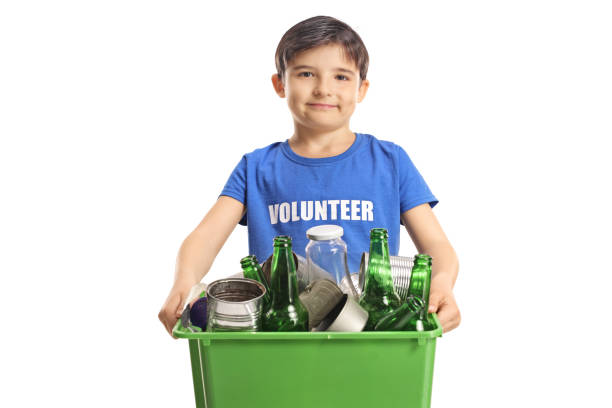 Boy volunteer holding a box with recycling bottles and cans