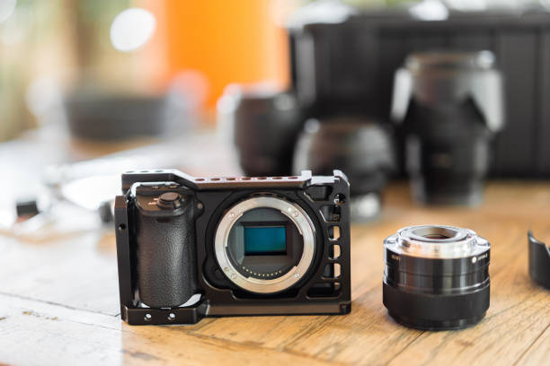 Mirrorless interchangeable-lens camera equipment preparing for videography stock photo