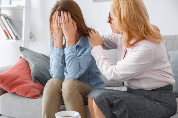 istock Female psychologyst therapy session with client indoors sitting girl crying 1143050708