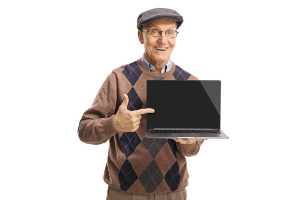 istock Senior man holding a laptop and pointing to the screen 1143050764